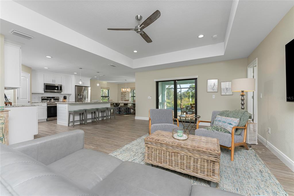 184 Spring Drive Rotonda West, FL 33947 - Photo 11 of 54 a living room with furniture kitchen view and a table