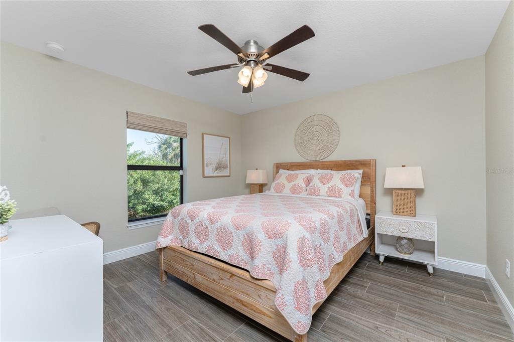 184 Spring Drive Rotonda West, FL 33947 - Photo 28 of 54 a bedroom with a bed and window