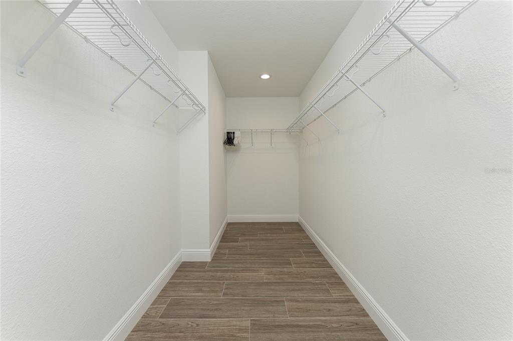 184 Spring Drive Rotonda West, FL 33947 - Photo 31 of 54 a view of a hallway with wooden floor