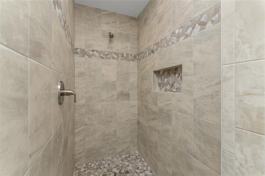 184 Spring Drive Rotonda West, FL 33947 - Photo 36 of 54 a bathroom with a shower