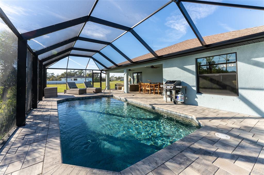 184 Spring Drive Rotonda West, FL 33947 - Photo 49 of 54 a view of a swimming pool with a patio