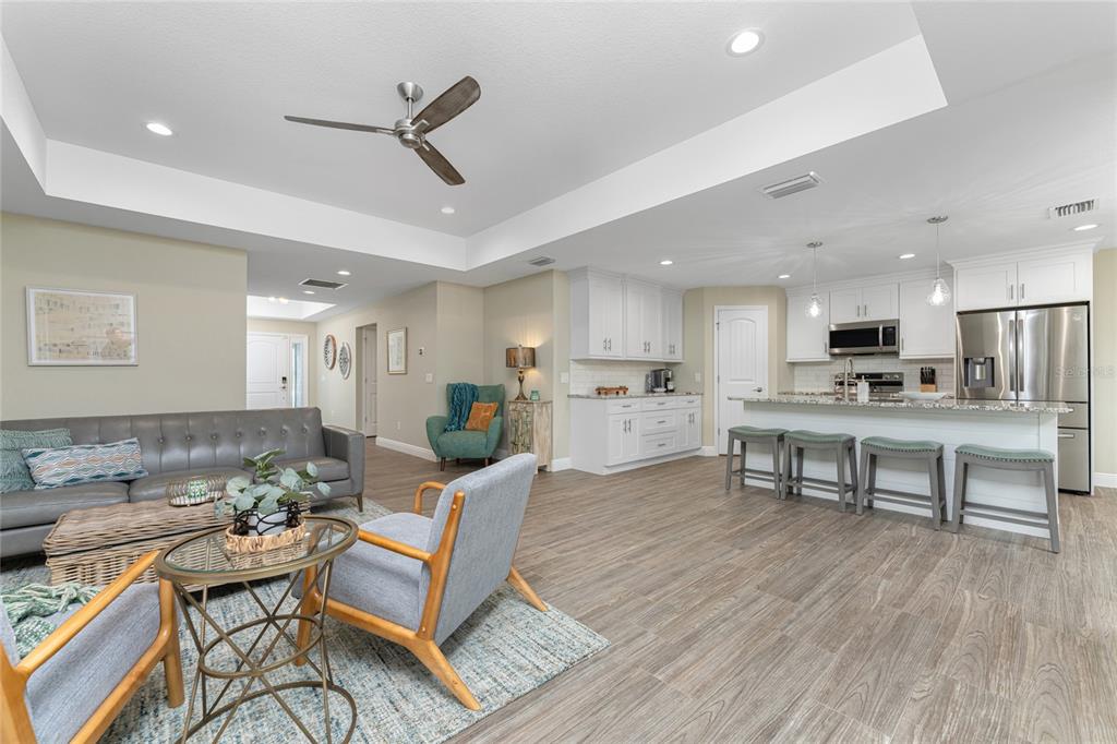 184 Spring Drive Rotonda West, FL 33947 - Photo 6 of 54 a living room with furniture and kitchen view
