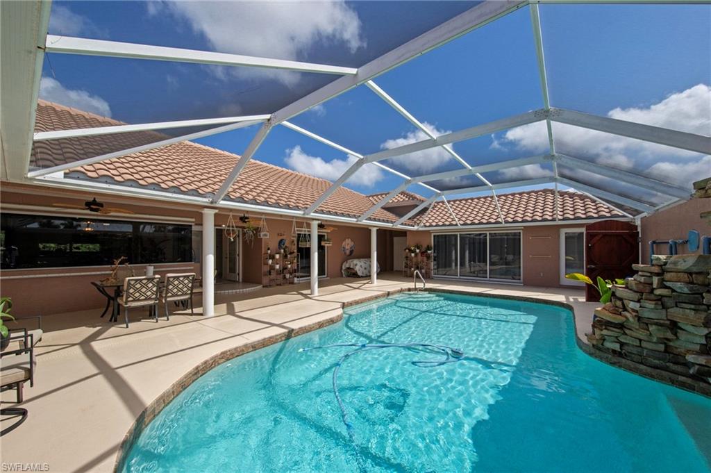 13541 Stringfellow Road Bokeelia, FL 33922 - Photo 28 of 49 a view of a house with sitting area and garden