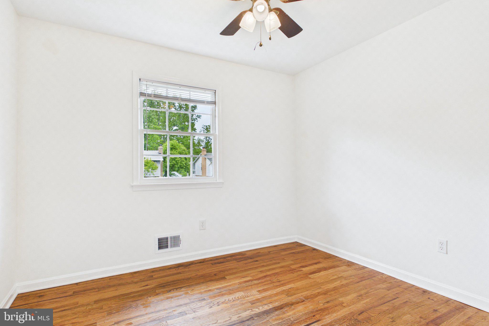 13235 Sturbridge Road Woodbridge, VA 22192 - Photo 44 of 53 Bright and airy room with hardwood floors.