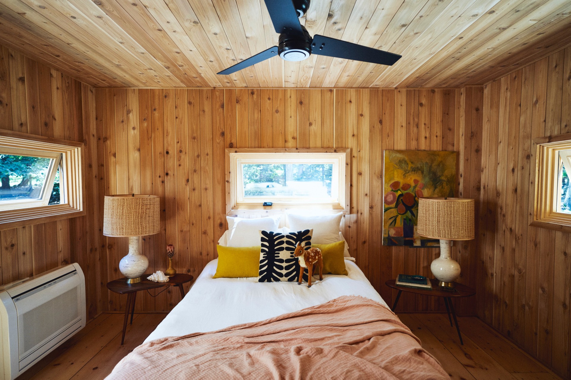 23 Neck Path East Hampton, NY 11937 - Photo 11 of 33 a bed room with a bed and a chandelier