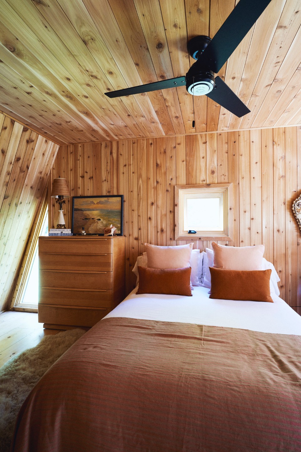 23 Neck Path East Hampton, NY 11937 - Photo 12 of 33 a bedroom with furniture and a large window