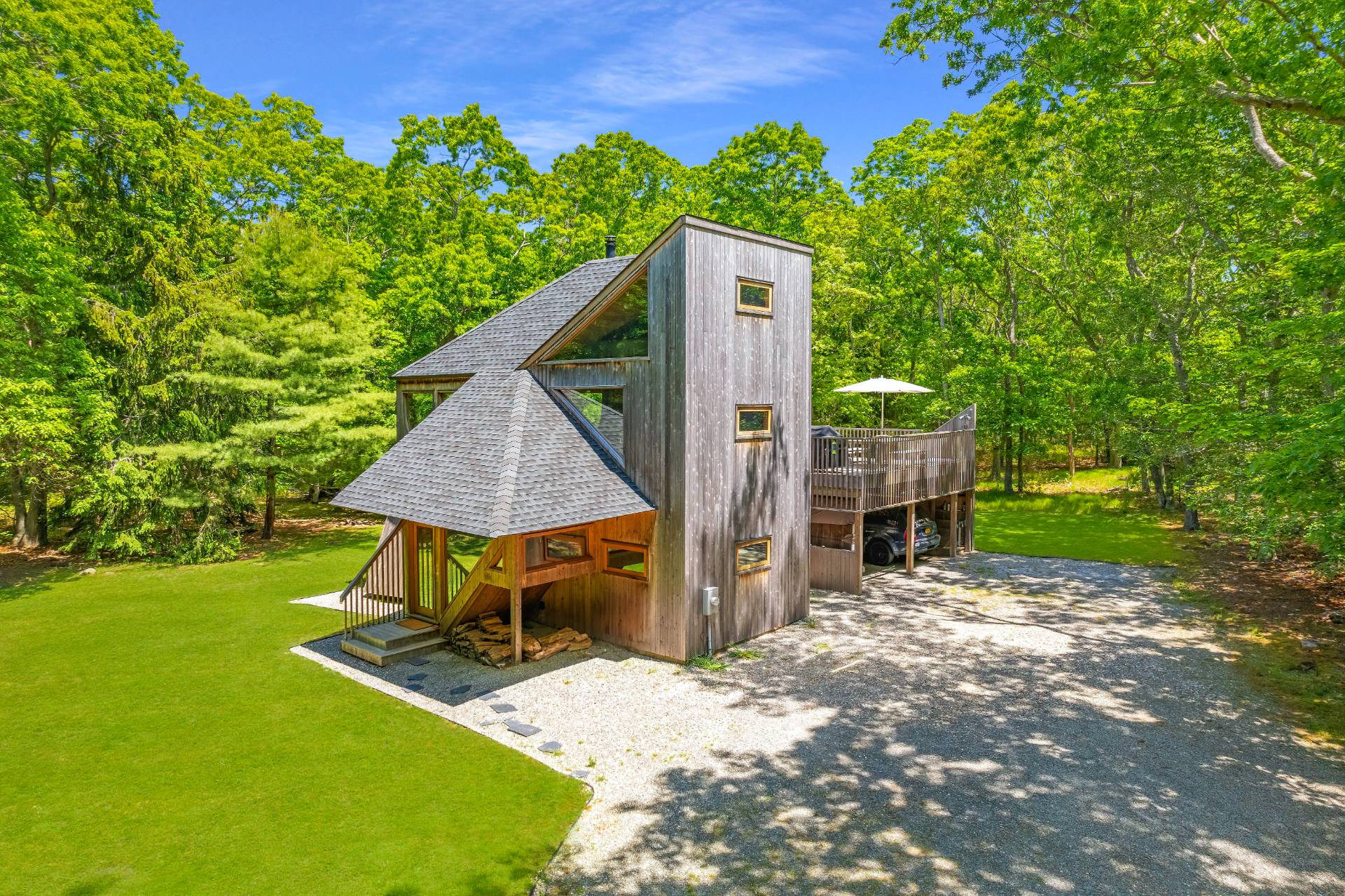 23 Neck Path East Hampton, NY 11937 - Photo 23 of 33 a view of a small house with a yard and sitting area