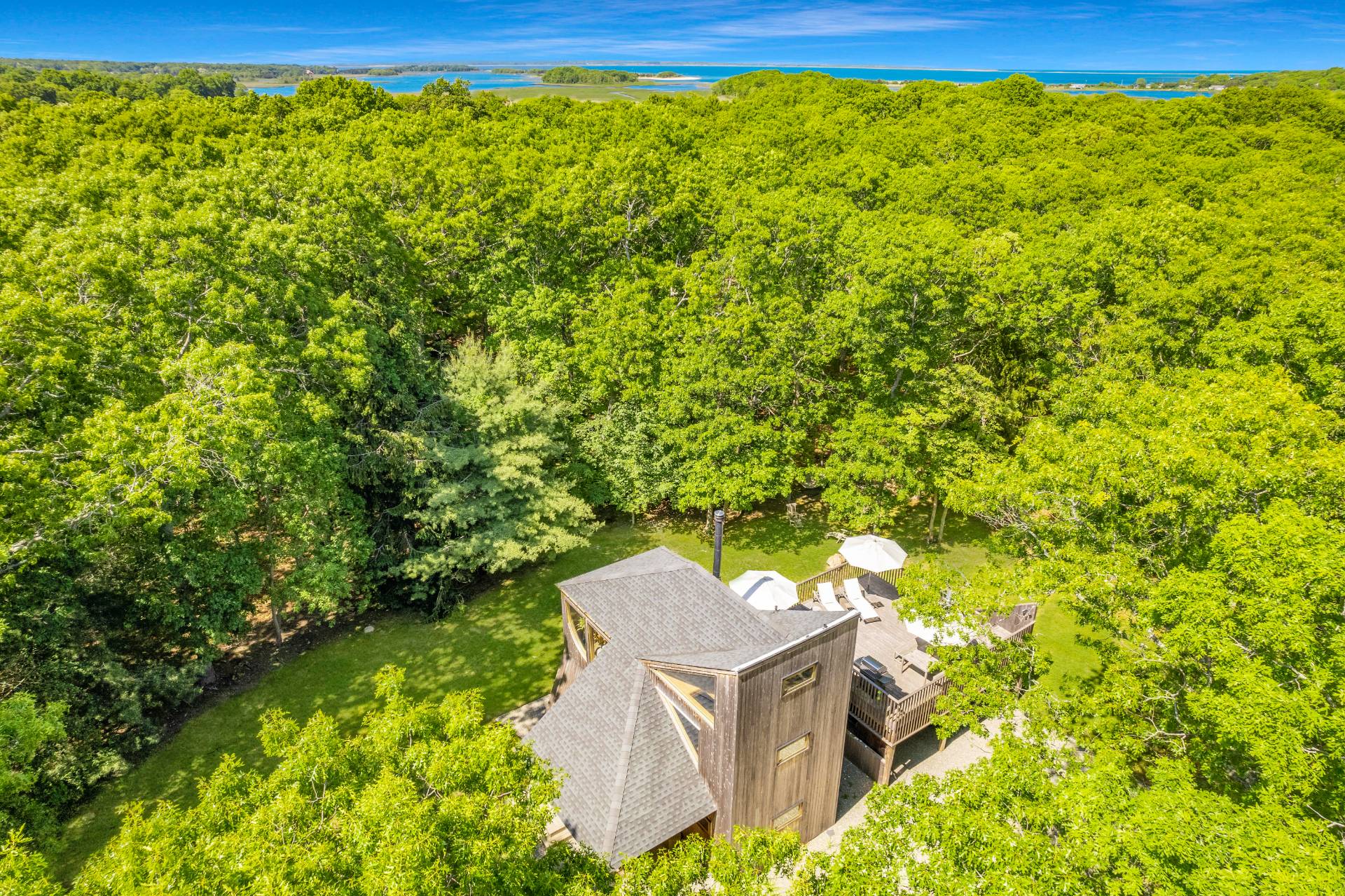 23 Neck Path East Hampton, NY 11937 - Photo 24 of 33 a view of a yard with an outdoor space