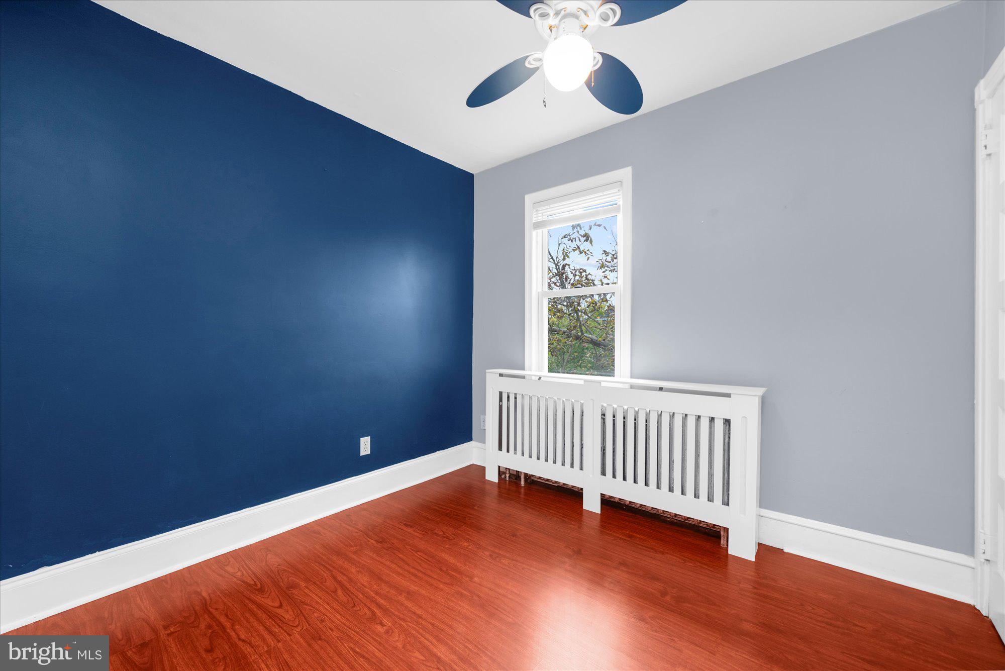 120 Linden Avenue Glenside, PA 19038 - Photo 12 of 28 a view of an empty room with window and wooden floor