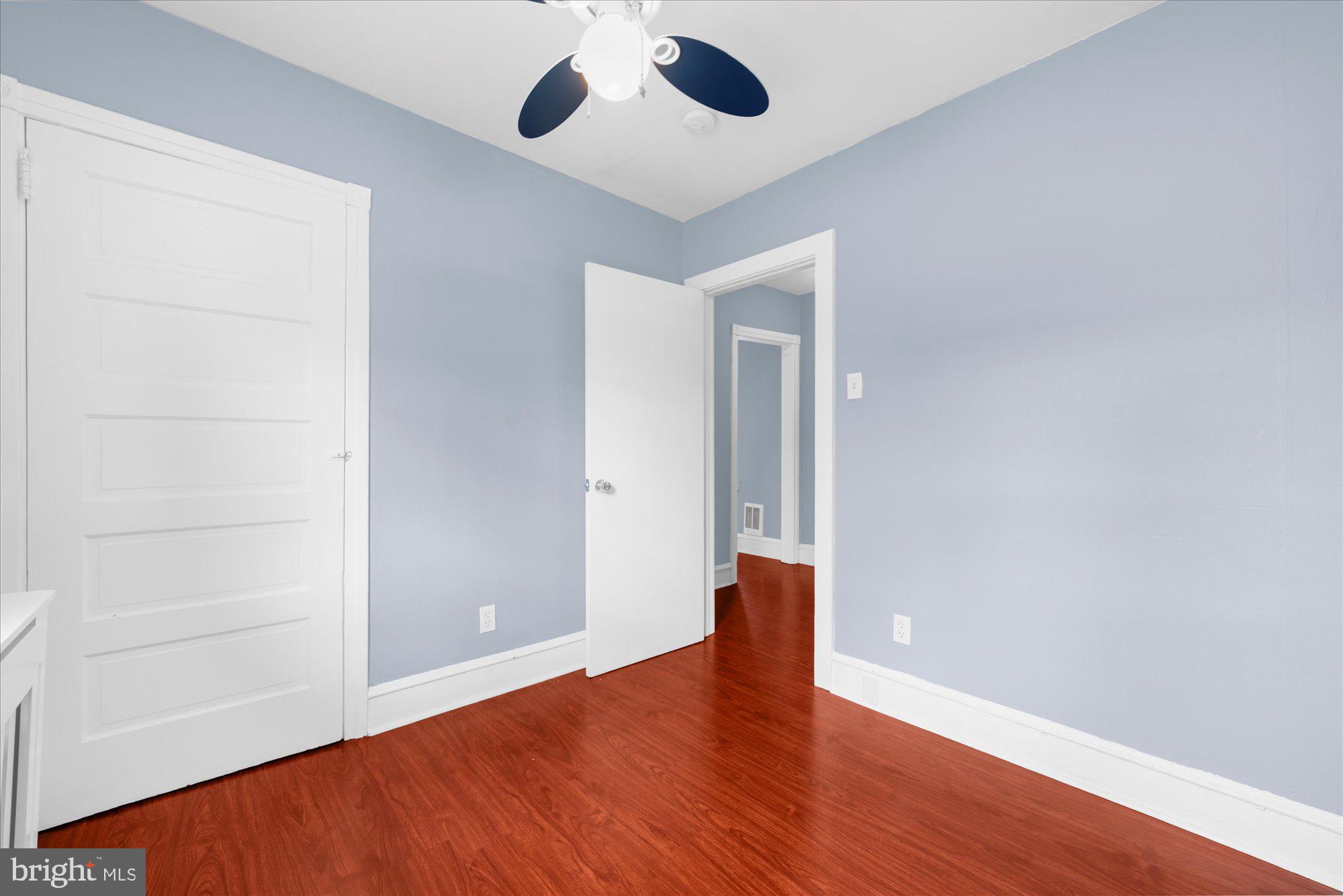 120 Linden Avenue Glenside, PA 19038 - Photo 13 of 28 an empty room with wooden floor chandelier fan and closet
