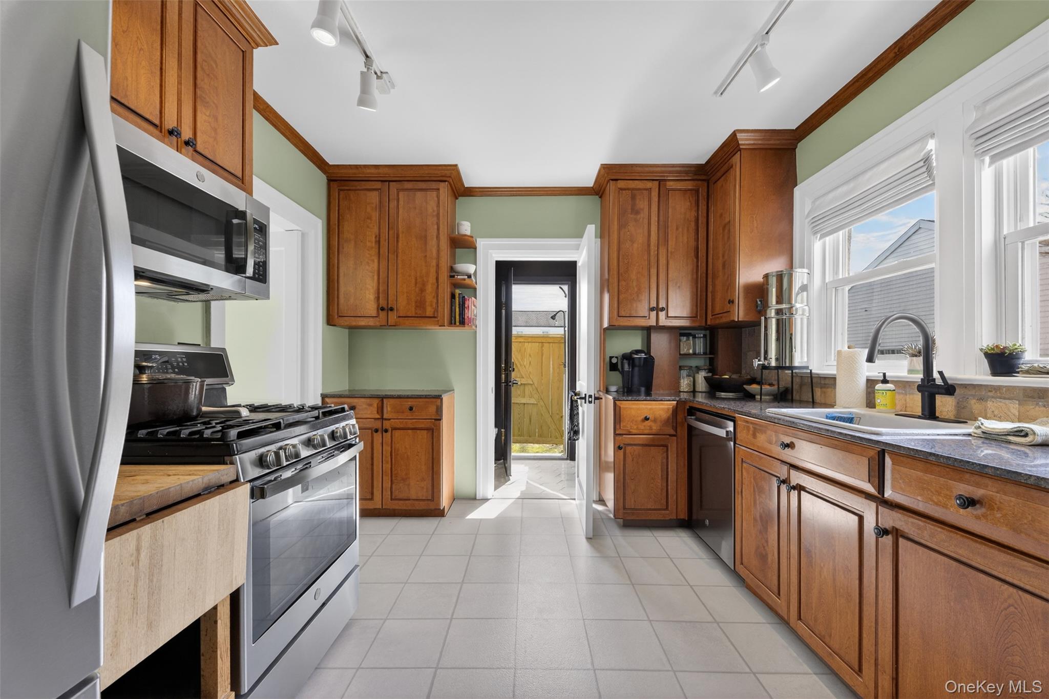 4 Spaulding Place Ossining, NY 10562 - Photo 15 of 43 a kitchen with stainless steel appliances granite countertop a stove top oven a sink and dishwasher
