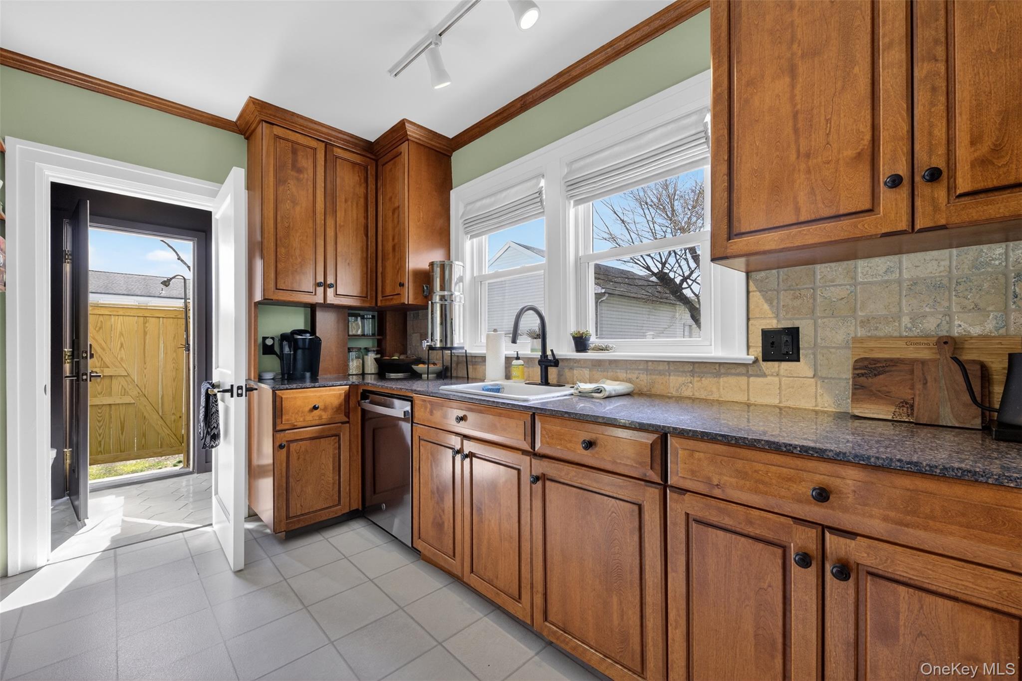 4 Spaulding Place Ossining, NY 10562 - Photo 16 of 43 a kitchen with stainless steel appliances granite countertop a sink and a stove
