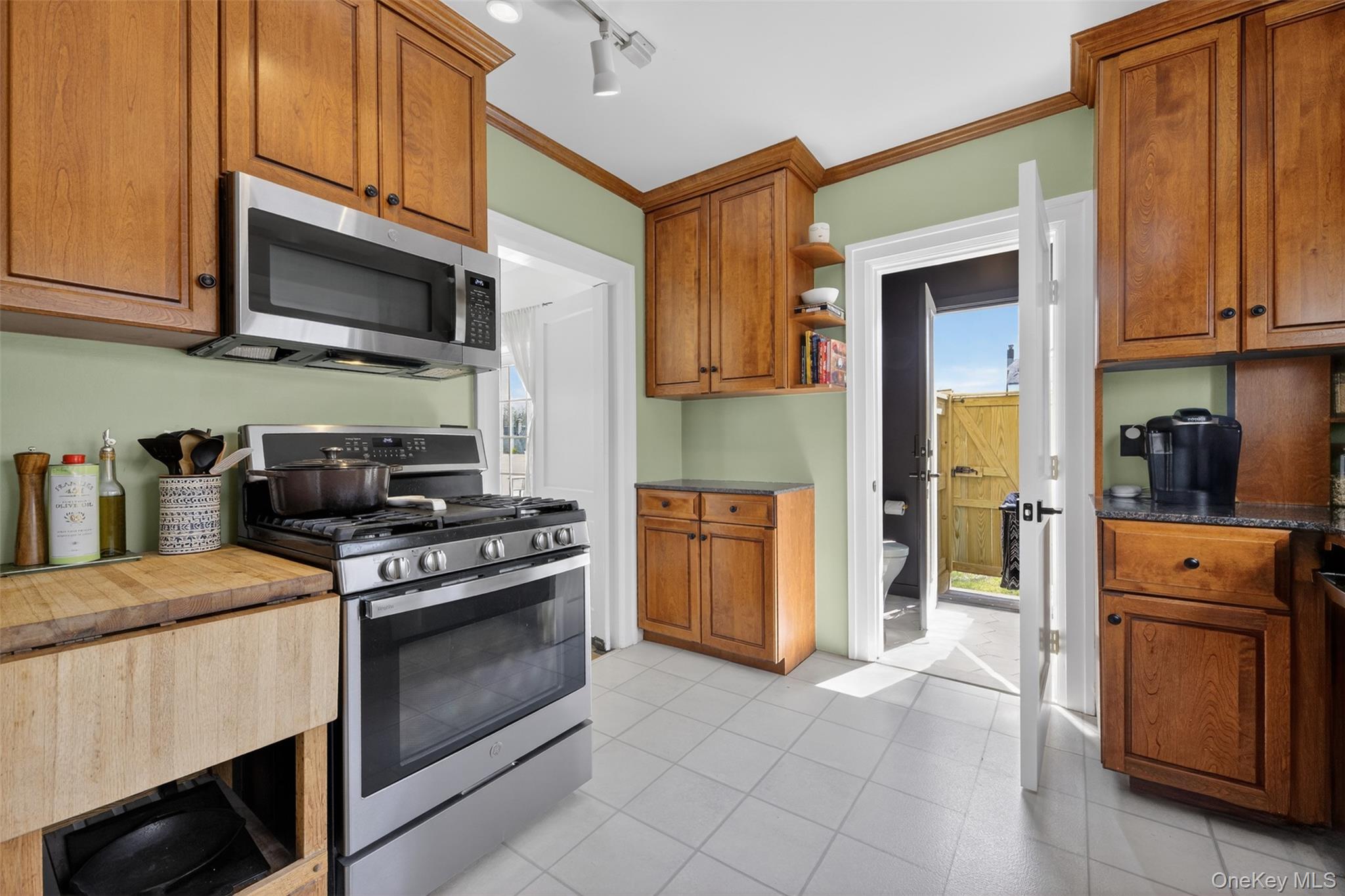 4 Spaulding Place Ossining, NY 10562 - Photo 17 of 43 a kitchen with stainless steel appliances granite countertop a stove microwave and refrigerator