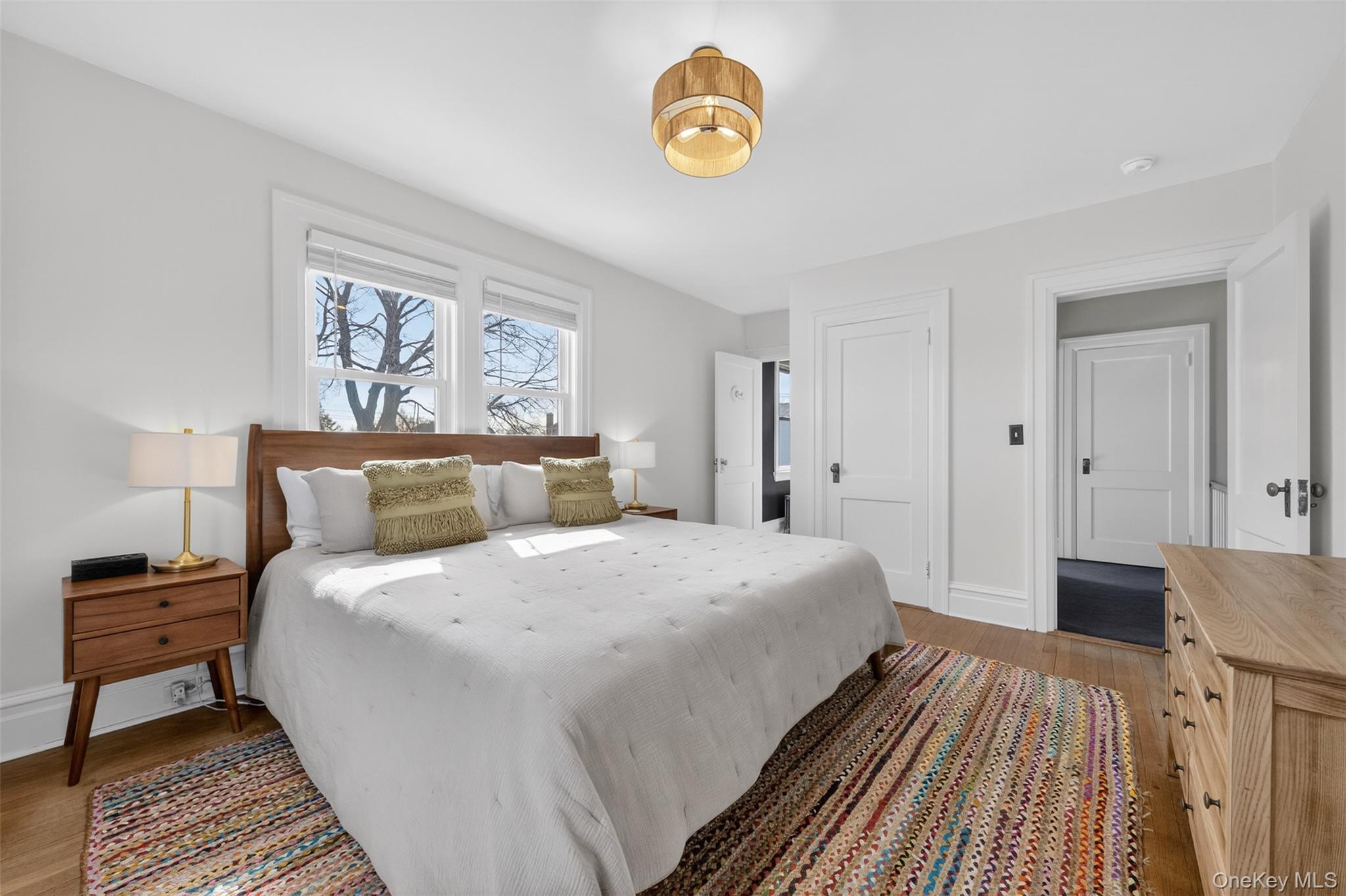 4 Spaulding Place Ossining, NY 10562 - Photo 25 of 43 a bedroom with a bed and a lamp on dresser
