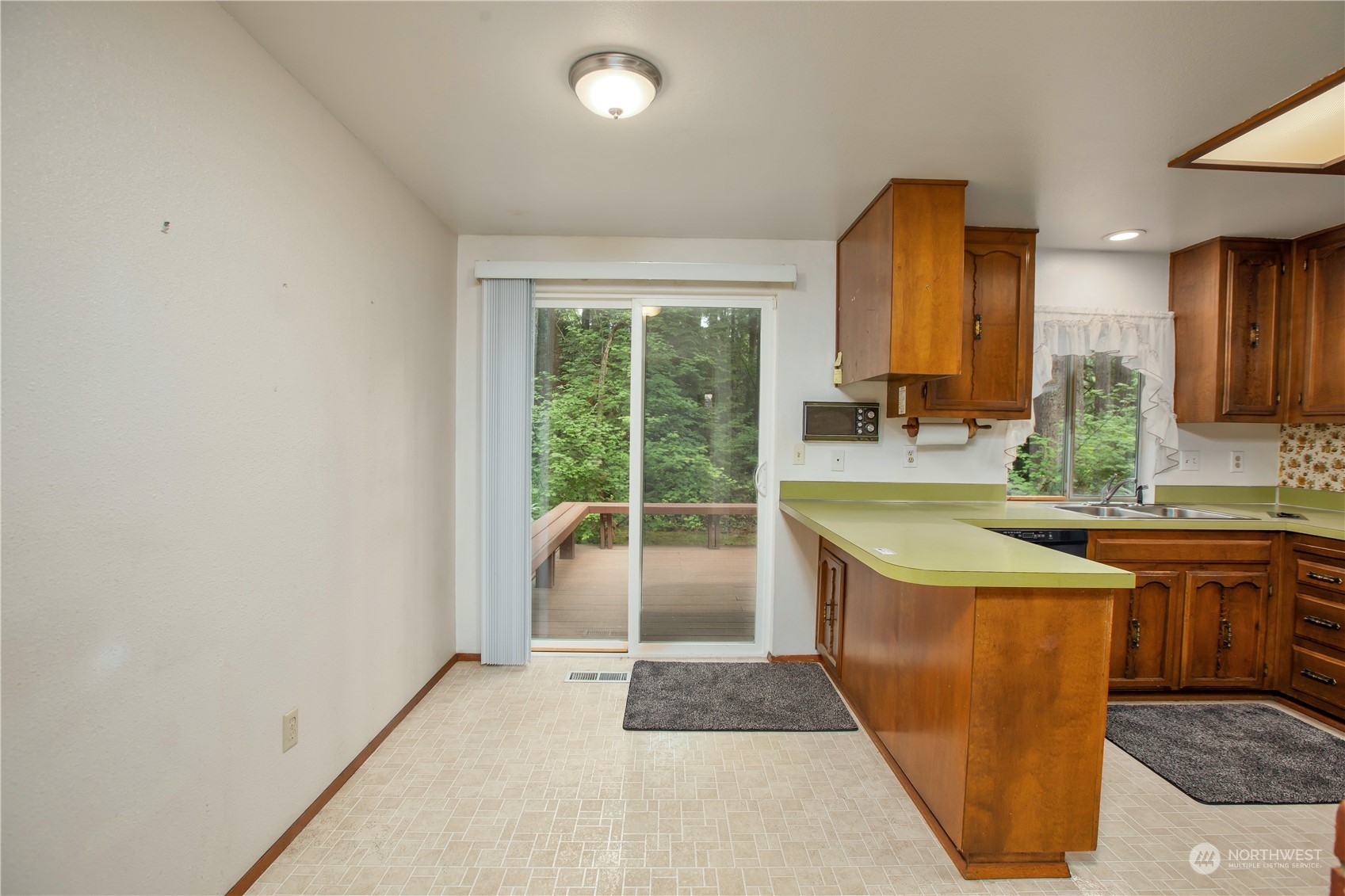 22509 45th Avenue Southeast Bothell, WA 98021 - Photo 12 of 31 a view of a kitchen with a sink and a window