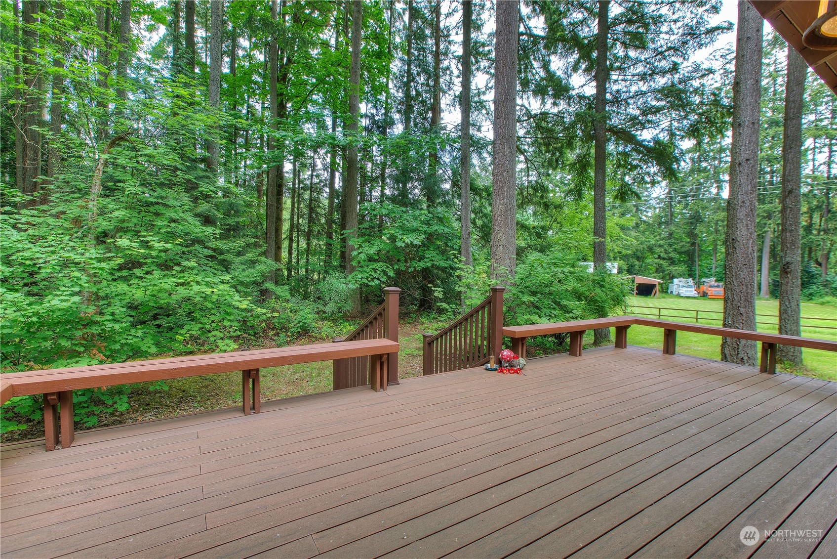 22509 45th Avenue Southeast Bothell, WA 98021 - Photo 13 of 31 a view of a deck with chairs and wooden fence