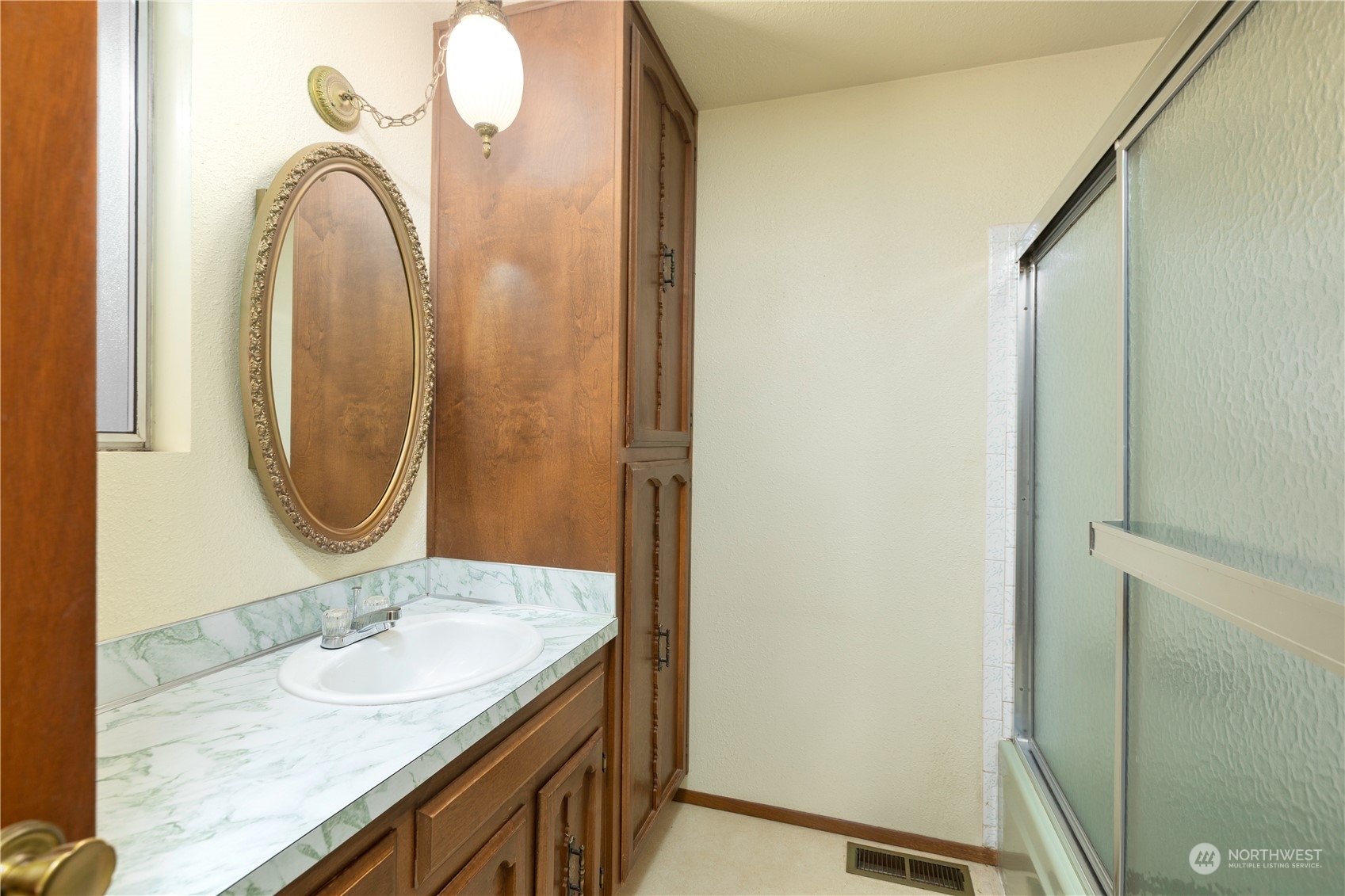 22509 45th Avenue Southeast Bothell, WA 98021 - Photo 18 of 31 a bathroom with a granite countertop sink and a mirror