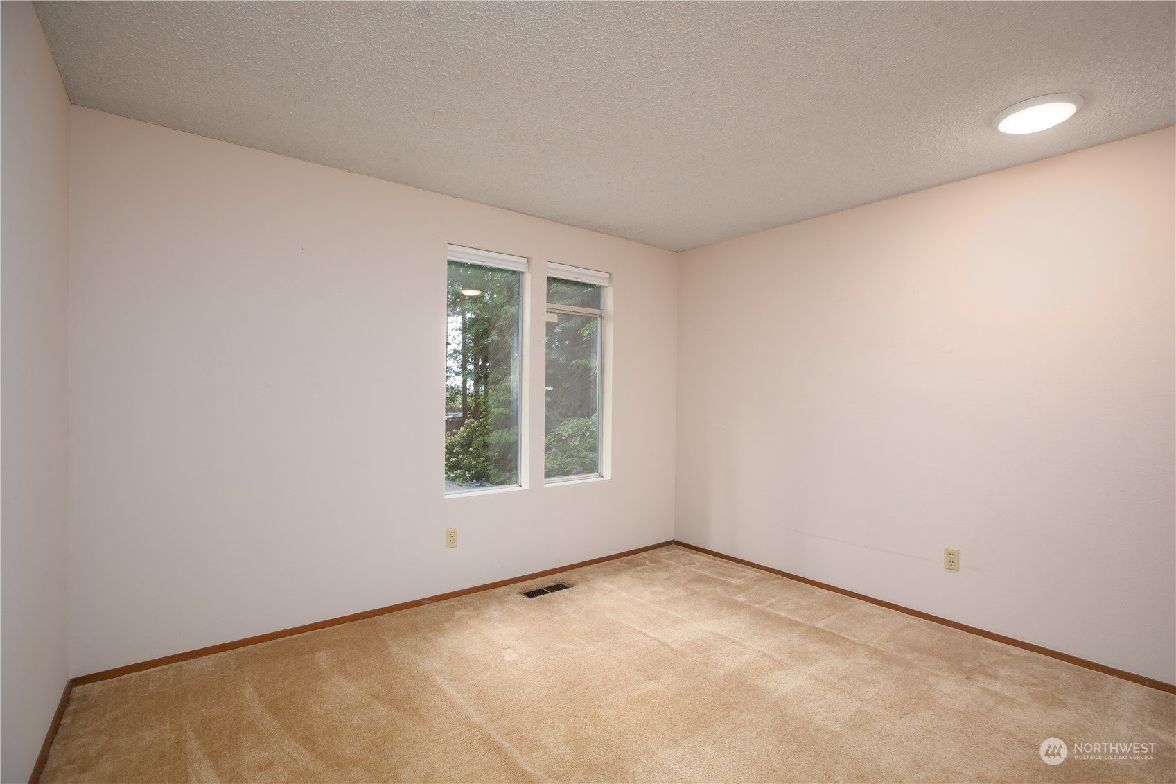 22509 45th Avenue Southeast Bothell, WA 98021 - Photo 20 of 31 an empty room with windows