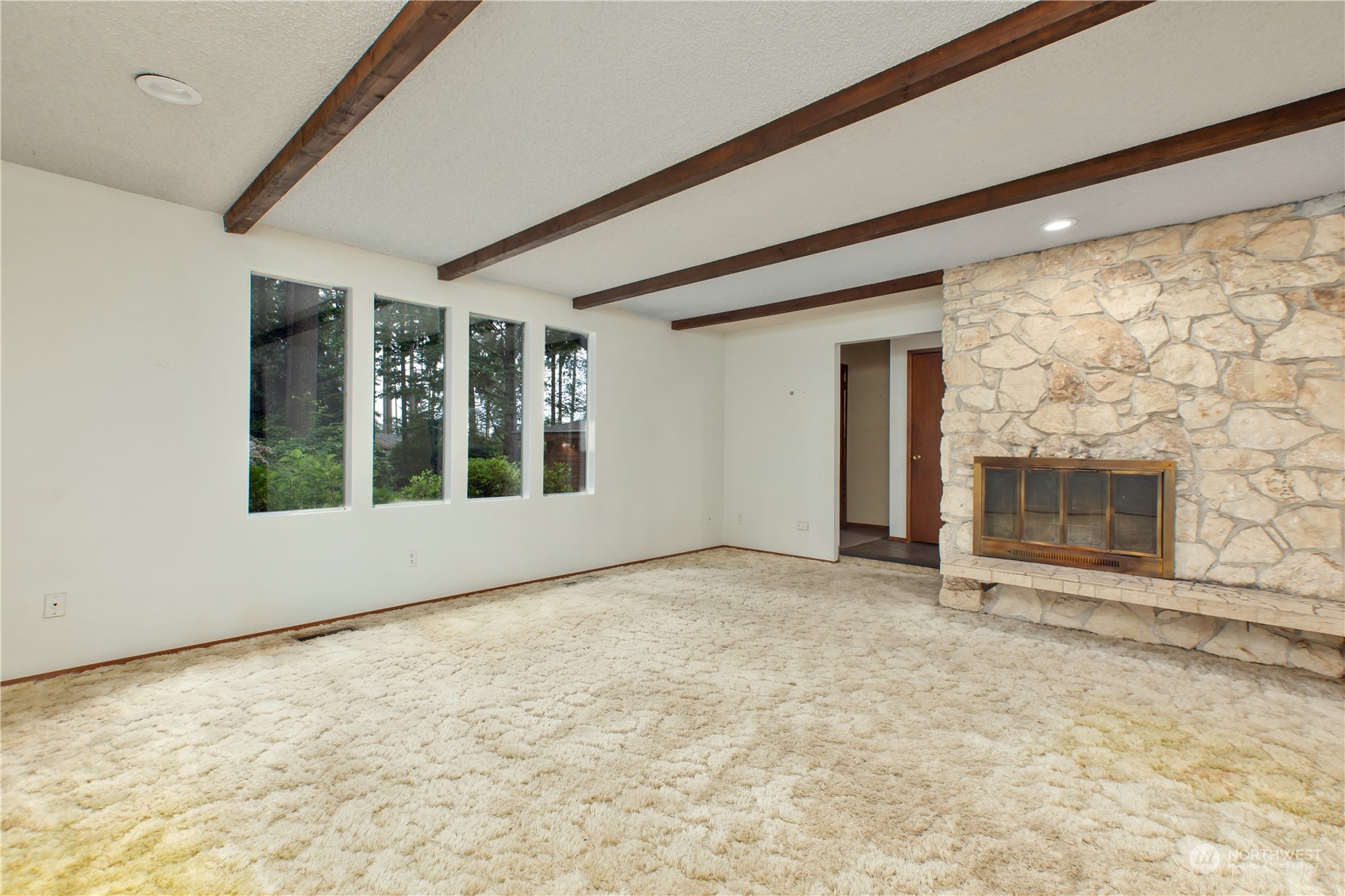 22509 45th Avenue Southeast Bothell, WA 98021 - Photo 4 of 31 a view of an empty room with a fireplace and a window