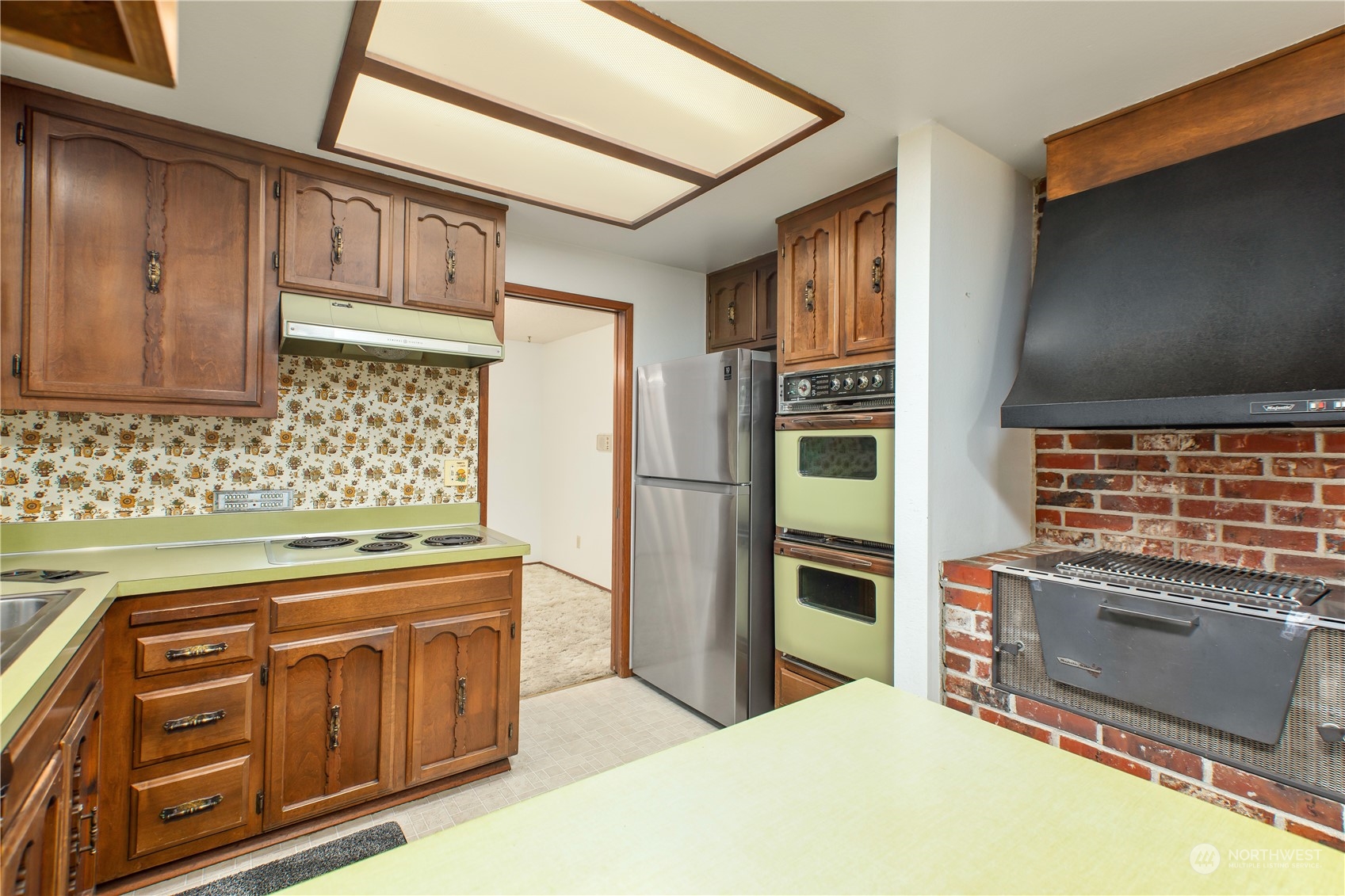 22509 45th Avenue Southeast Bothell, WA 98021 - Photo 10 of 31 a kitchen with stainless steel appliances granite countertop a stove and a sink