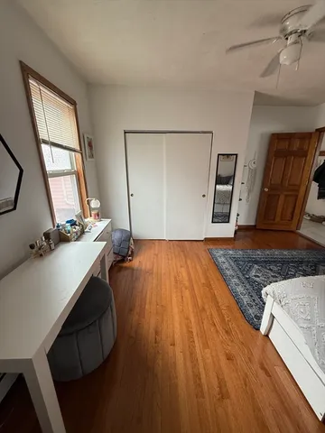 a view of a balcony with wooden floor