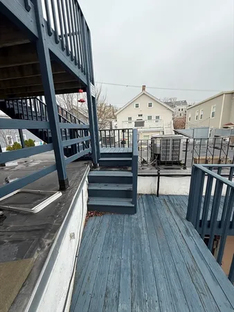 a view of balcony with deck and wooden floor