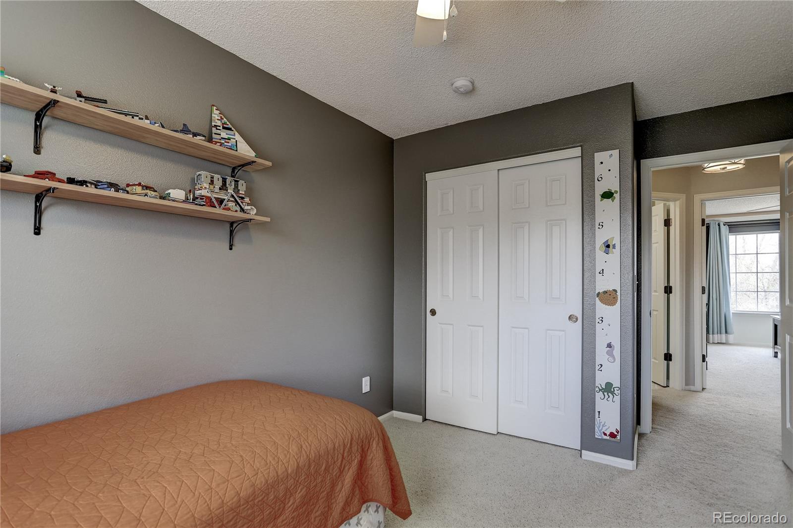 10626 Hyacinth Court Highlands Ranch, CO 80129 - Photo 20 of 38 an empty room with a dresser
