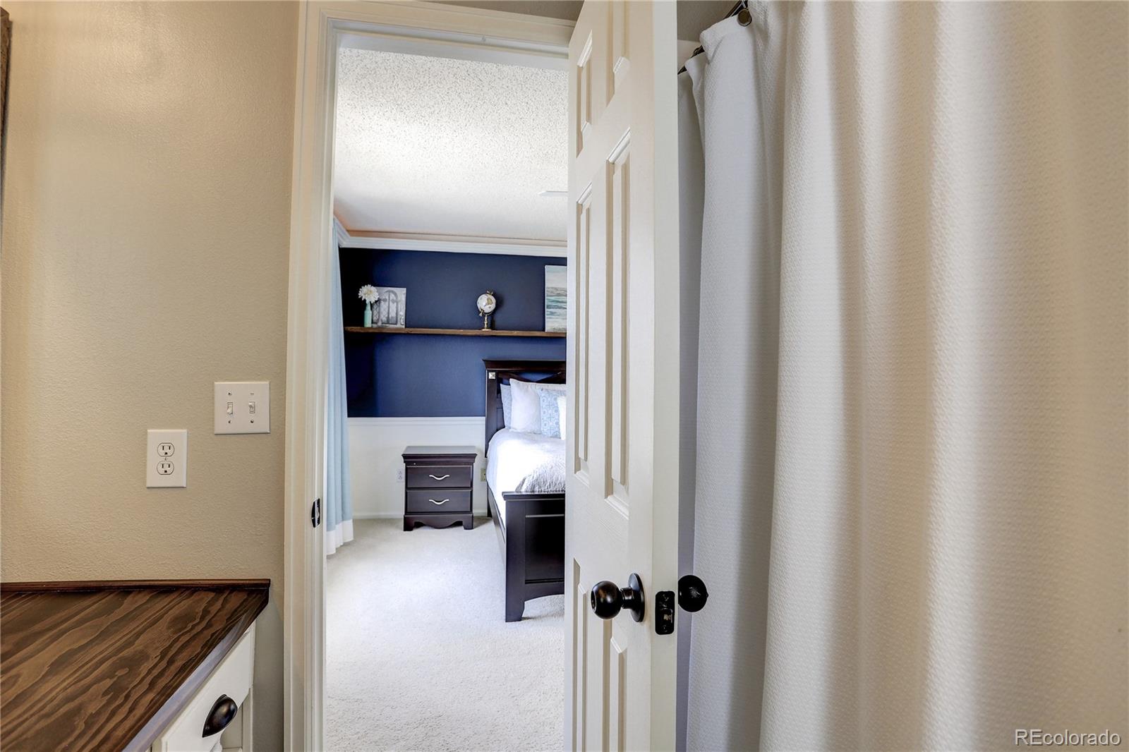10626 Hyacinth Court Highlands Ranch, CO 80129 - Photo 28 of 38 a view of kitchen and living room