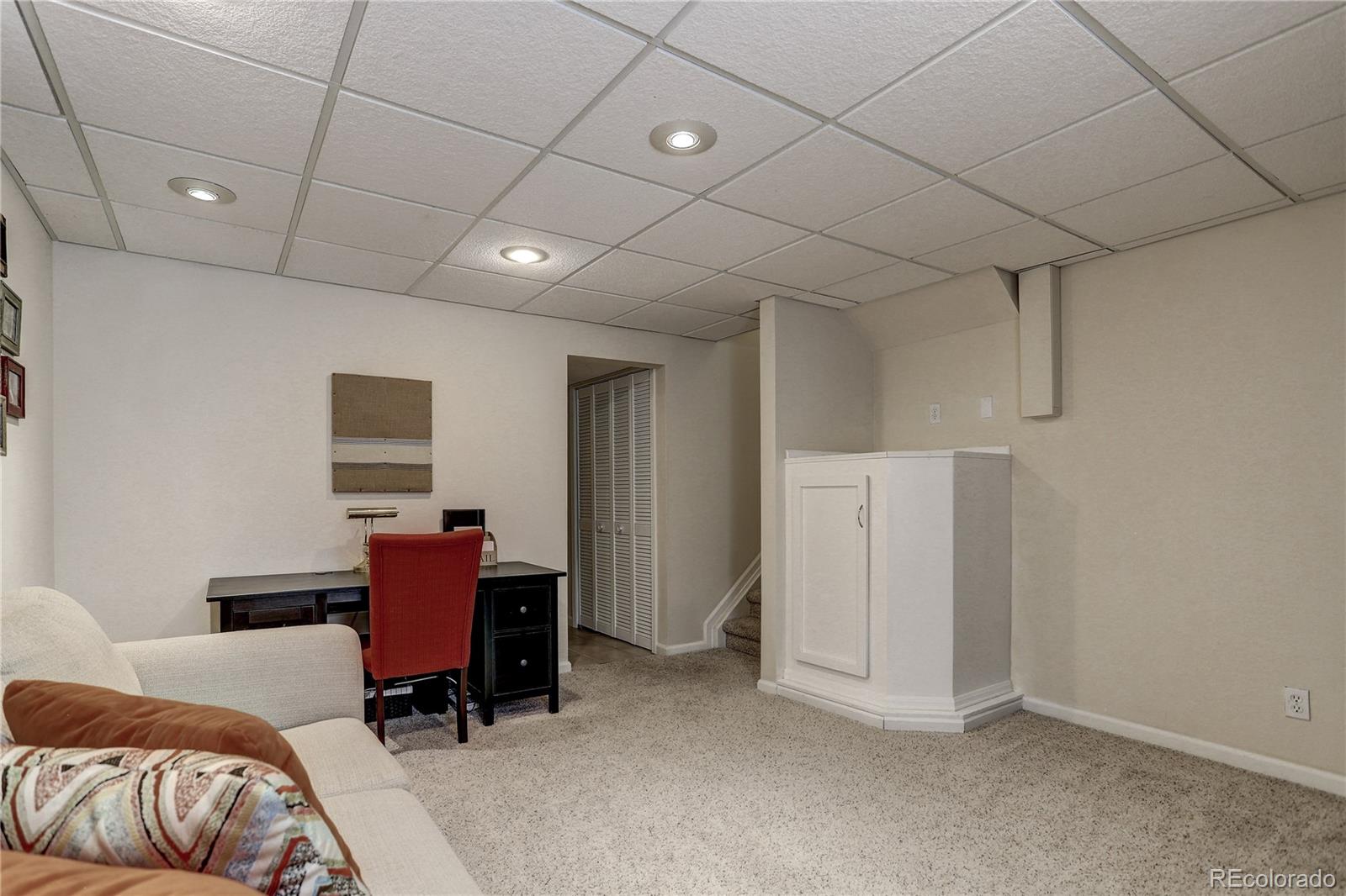 10626 Hyacinth Court Highlands Ranch, CO 80129 - Photo 32 of 38 a view of a livingroom with furniture