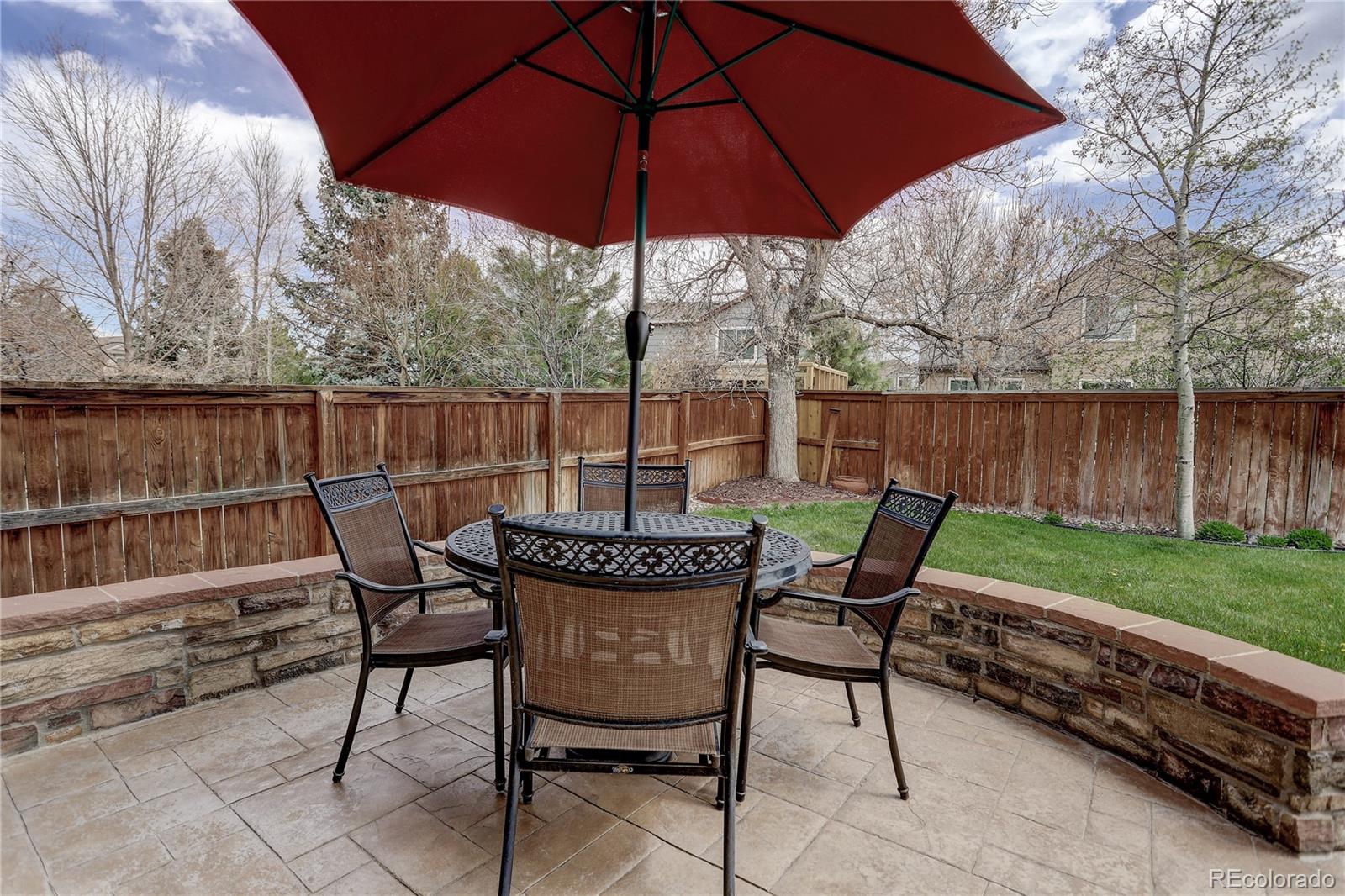 10626 Hyacinth Court Highlands Ranch, CO 80129 - Photo 37 of 38 a view of chair and tables in the back yard