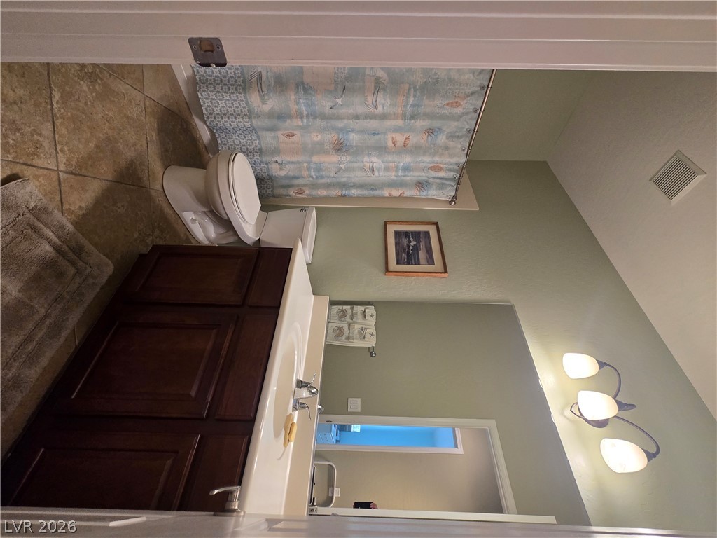 2567 Dirleton Place Henderson, NV 89044 - Photo 45 of 67 A well-appointed bathroom with a spacious vanity, complete with essential fixtures.