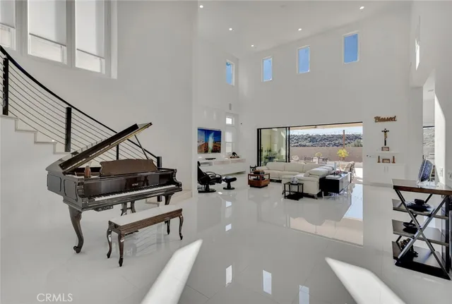a living room with furniture a table tennis pool and furniture
