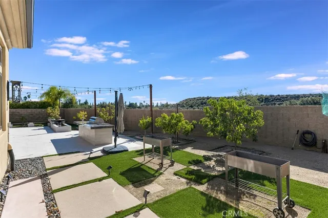 front view of a house with a small white building