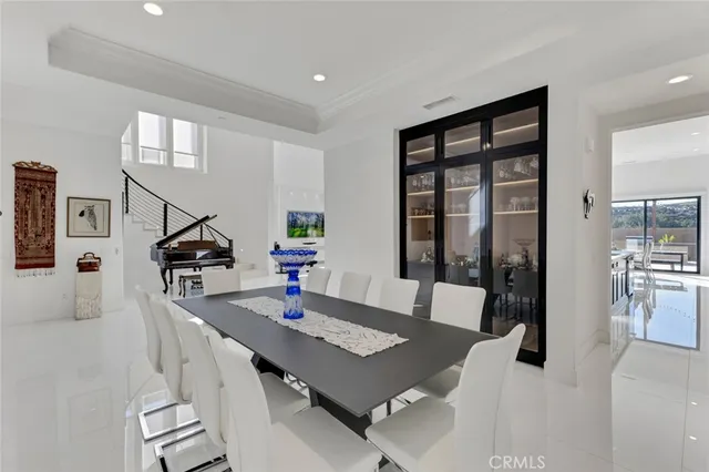 a view of a dining room with furniture and a potted plant