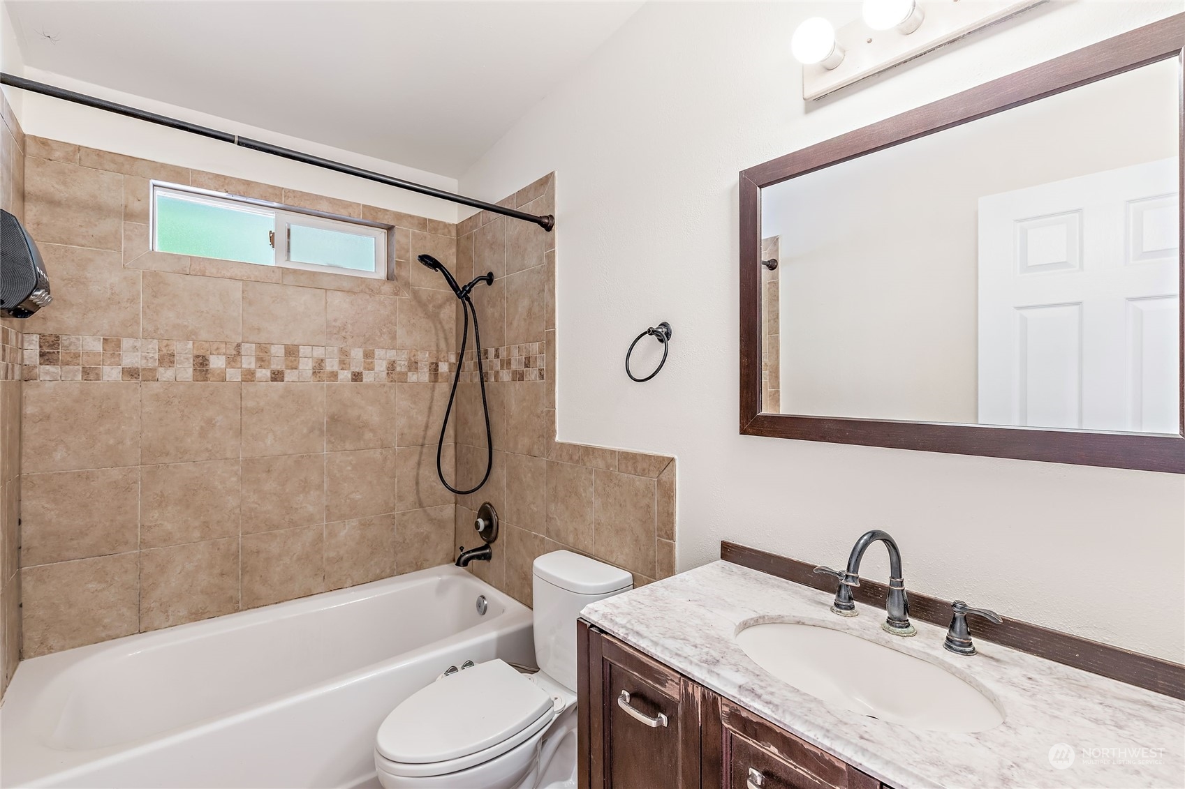 13207 178th Avenue Southeast Renton, WA 98059 - Photo 12 of 15 a bathroom with a granite countertop sink toilet and shower