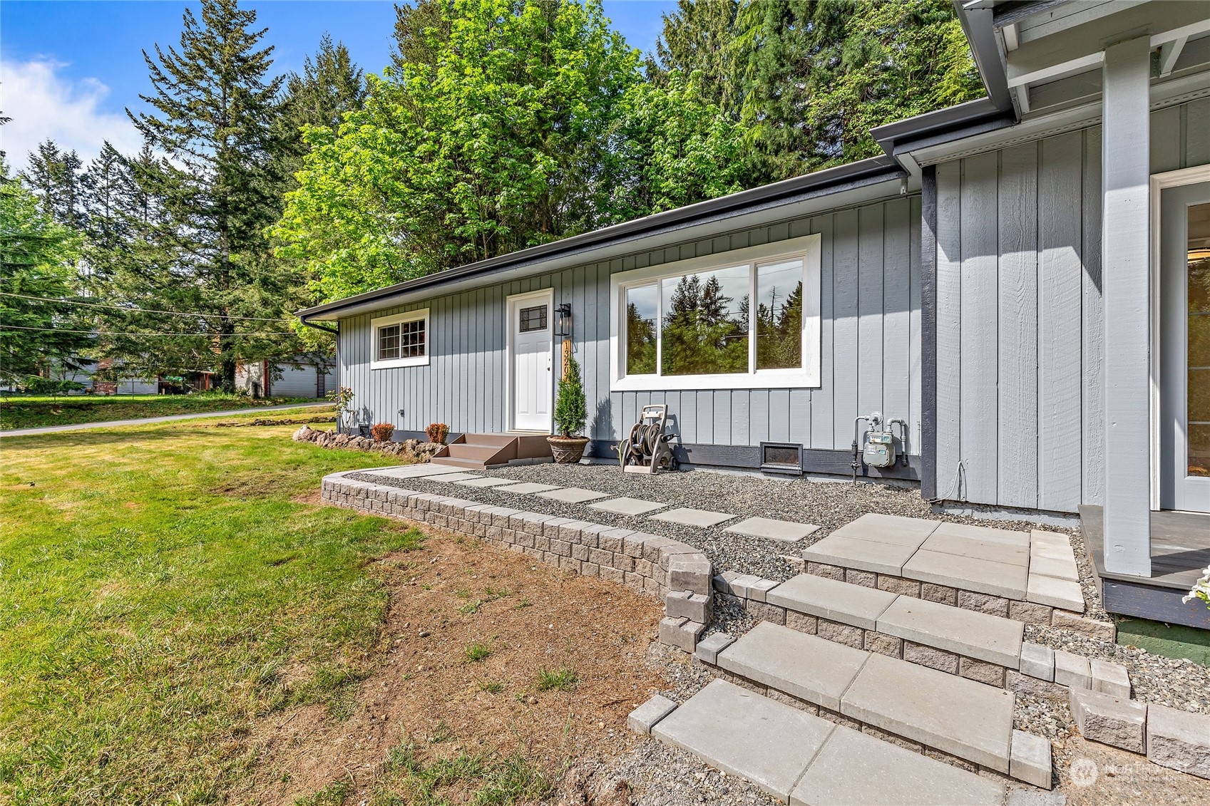 13207 178th Avenue Southeast Renton, WA 98059 - Photo 2 of 15 a house view with a sitting space and garden space
