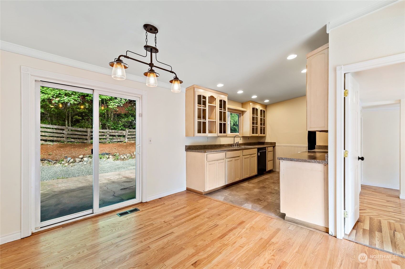 13207 178th Avenue Southeast Renton, WA 98059 - Photo 5 of 15 a view of a kitchen with kitchen island wooden floors and stainless steel appliances
