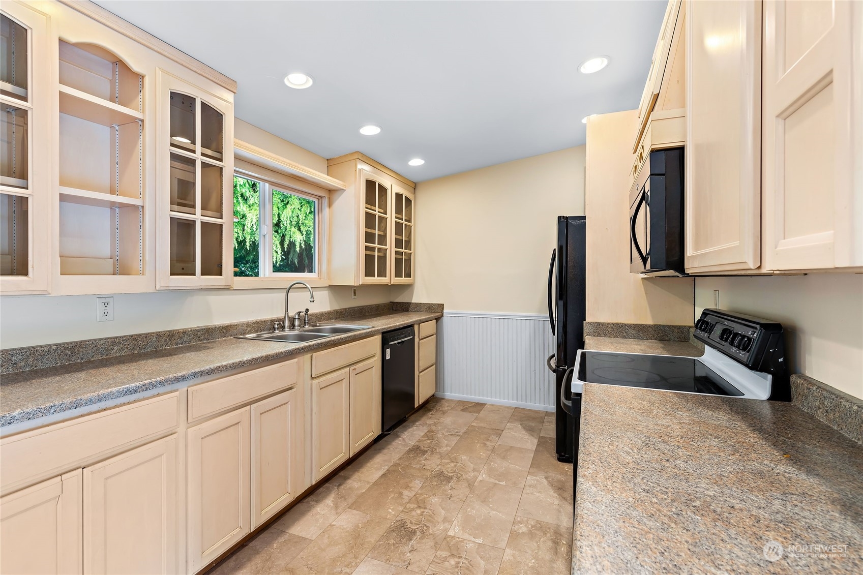 13207 178th Avenue Southeast Renton, WA 98059 - Photo 7 of 15 a kitchen with stainless steel appliances granite countertop a sink stove and cabinets