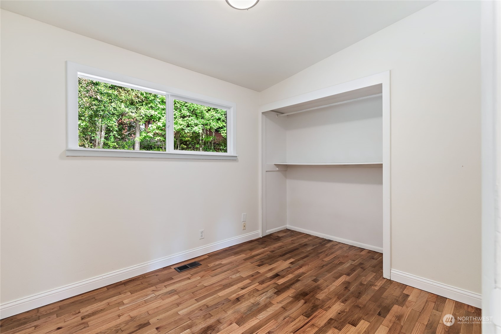 13207 178th Avenue Southeast Renton, WA 98059 - Photo 10 of 15 a view of empty room with wooden floor and fan