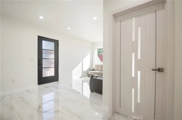 a view of a hallway with an entryway