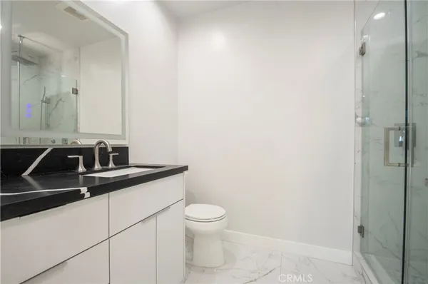 a close view of a sink and a toilet