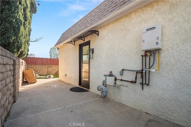 a view of a patio with a table and chairs