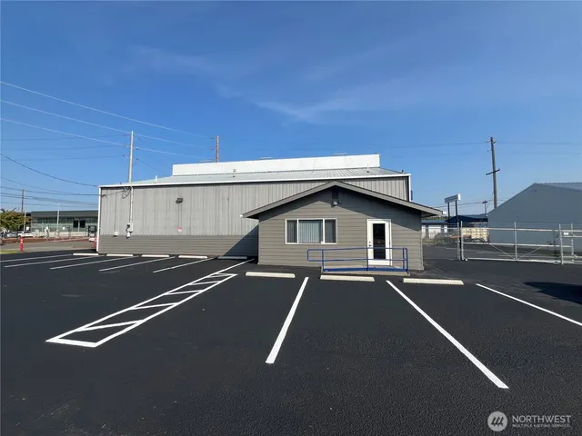 a view of a street with a car parked on road