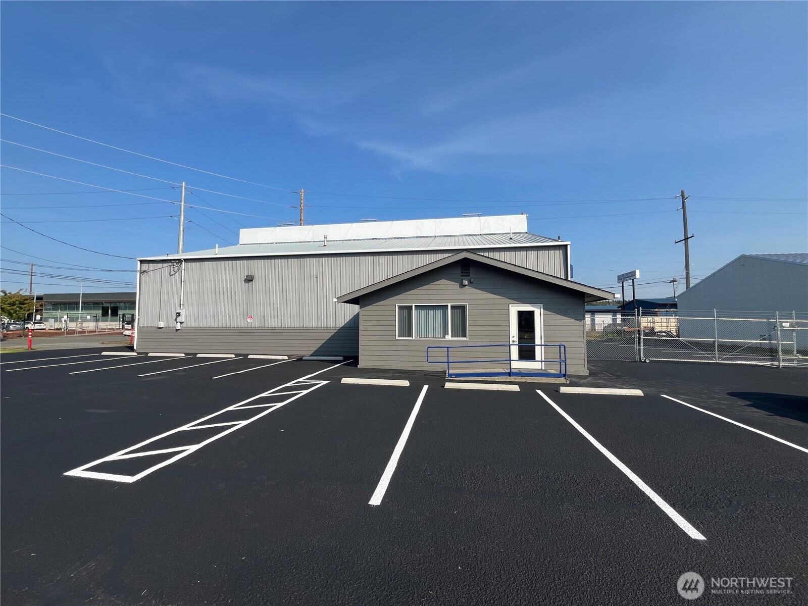 a view of a street with a car parked on road