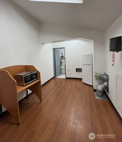 a room with a wooden floor and a chair