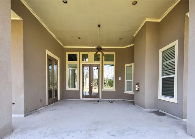 a view of entryway and hall with a fireplace