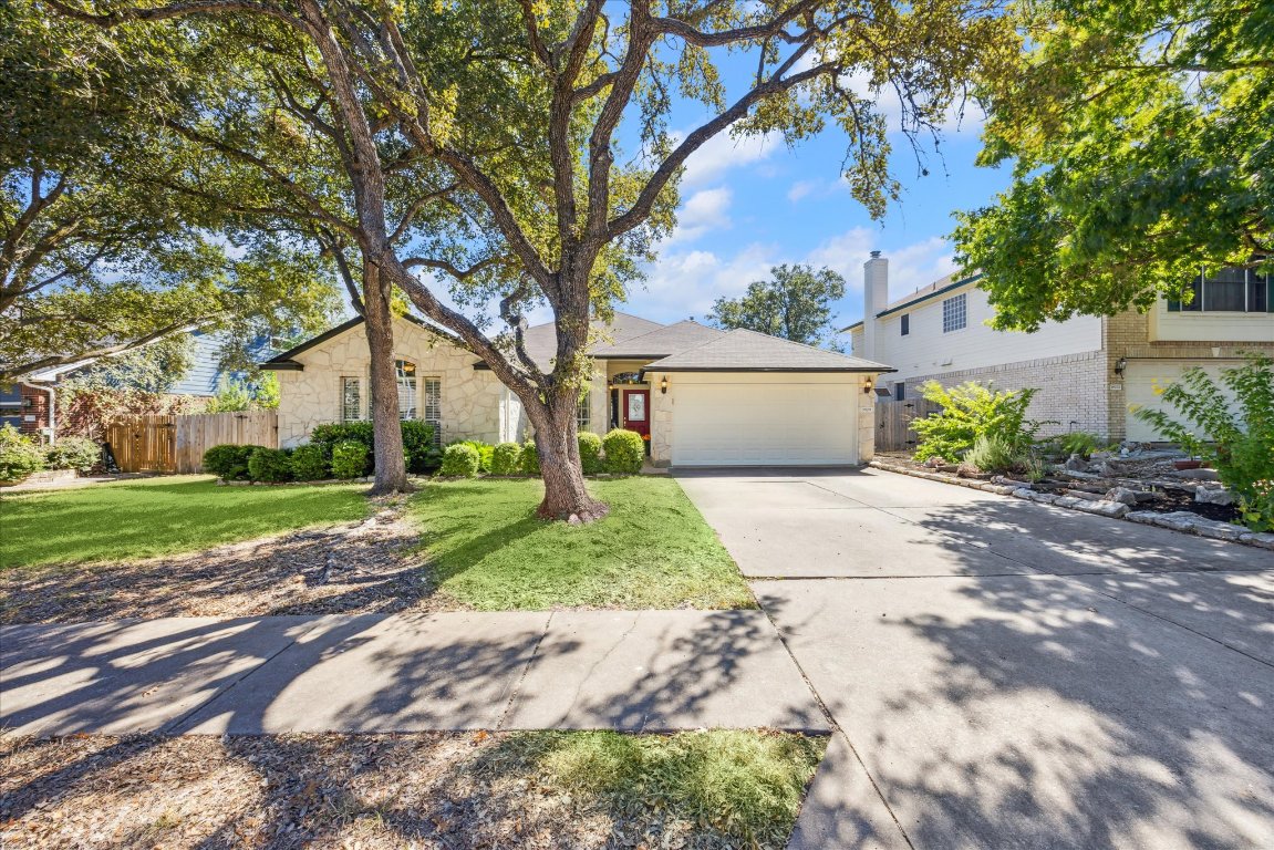 a view of a yard with a house and trees