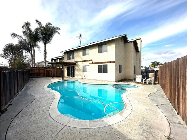 a view of a house with swimming pool