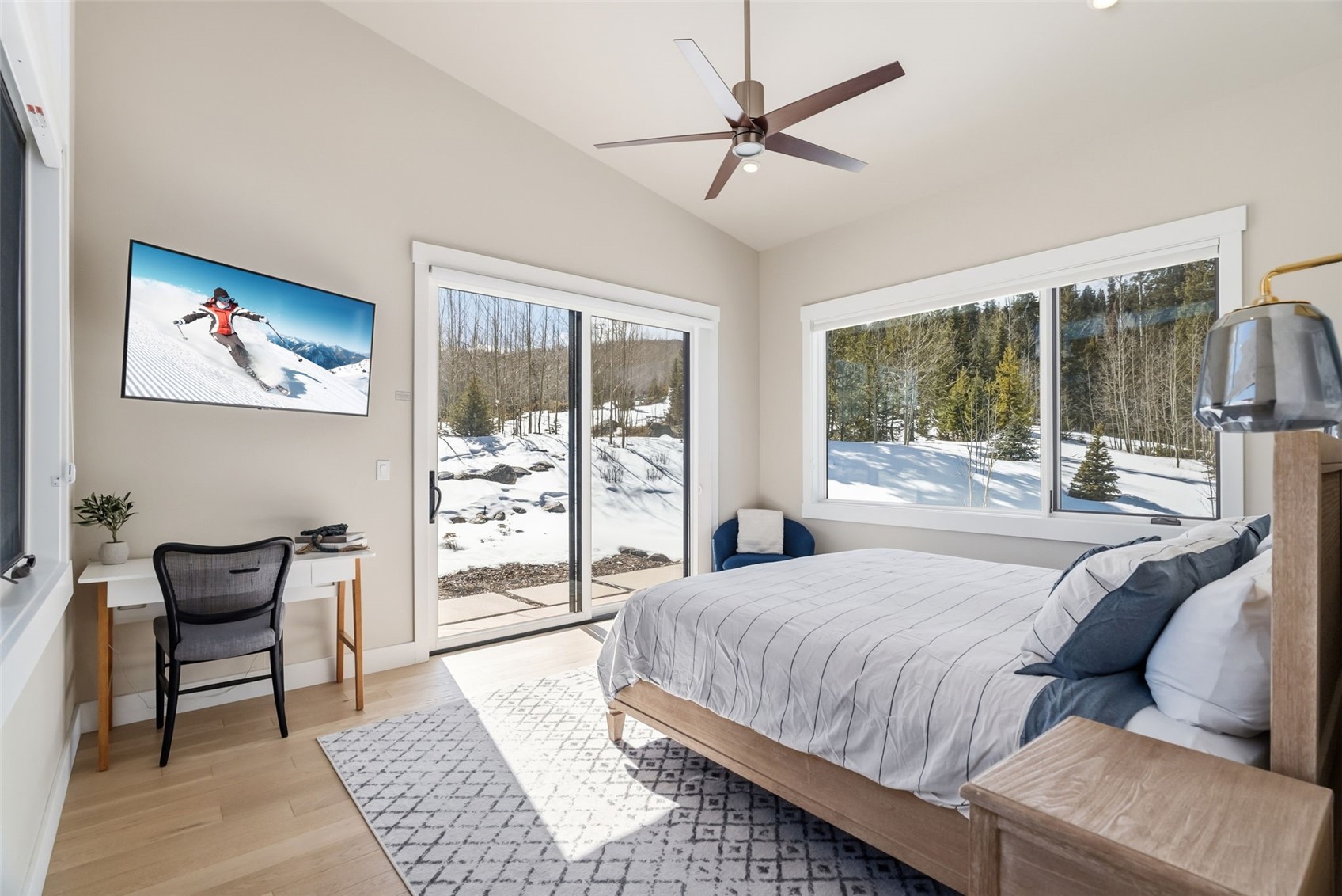 283 McKay Road Silverthorne, CO 80498 - Photo 14 of 47 Peaceful bedroom with natural light and forested surroundings.