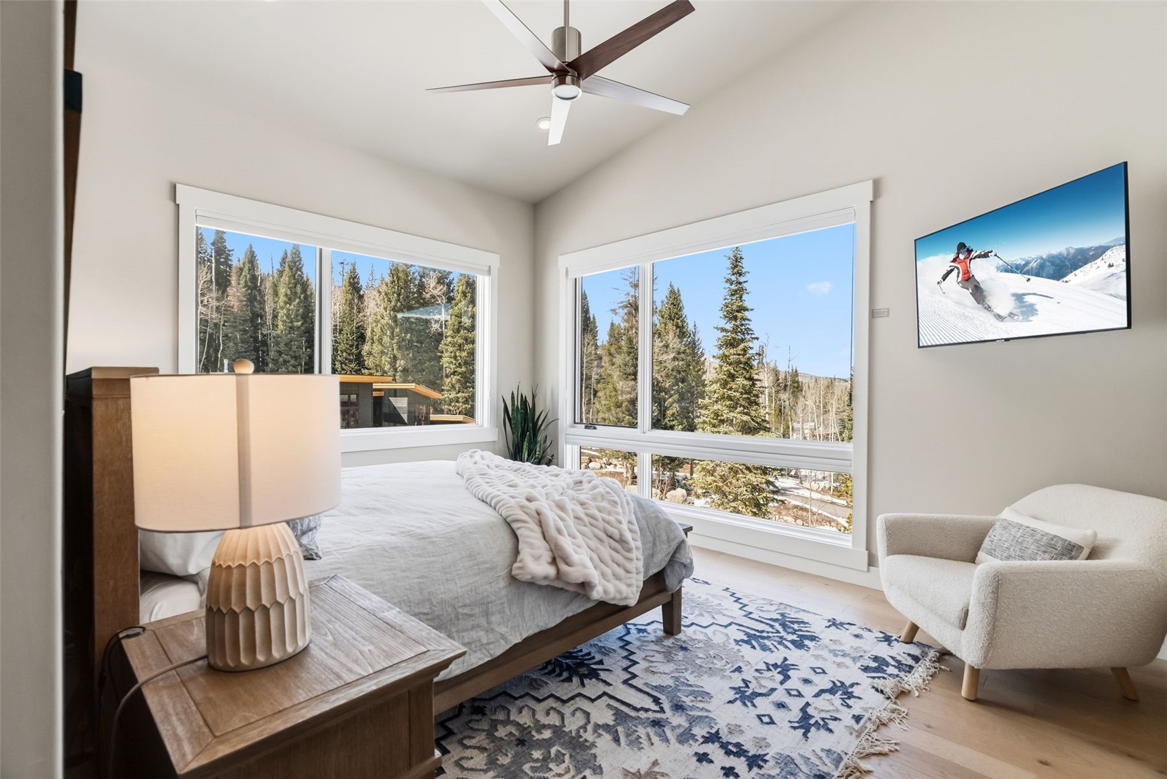 283 McKay Road Silverthorne, CO 80498 - Photo 17 of 47 Peaceful bedroom with natural light and forested surroundings.